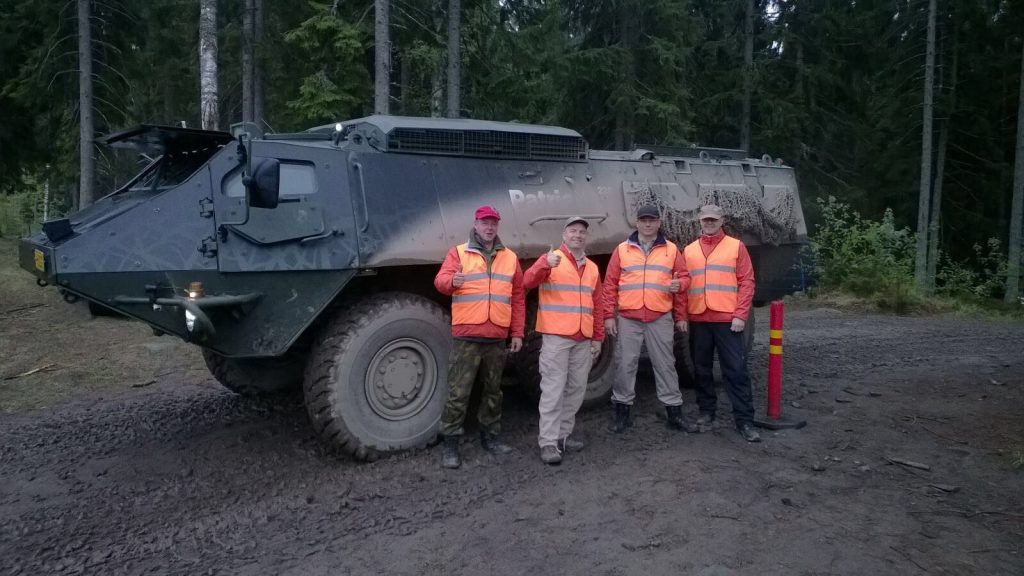 Top Management of Patria’s Land business unit after their driving turn from 3 AM to 6 AM with happy faces. Some 600 km completed.