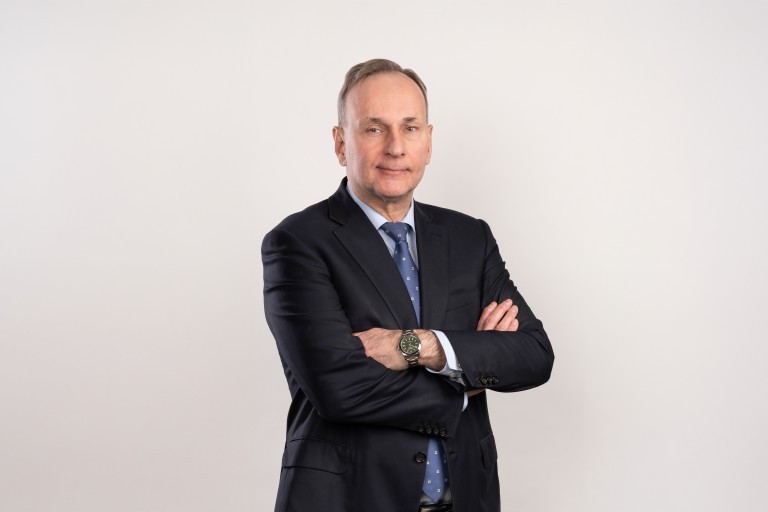 Esa Rautalinko looks standing at the camera.