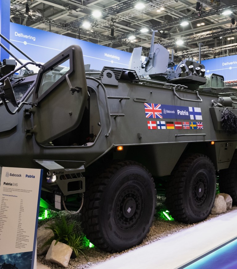 Patria 6x6 vehicle with CAVS programme parteners' flags.