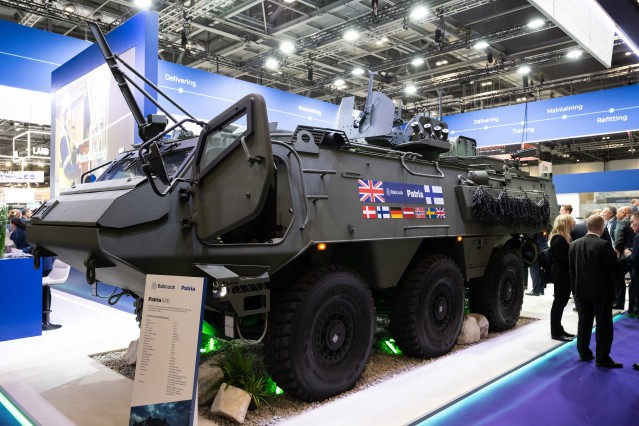 Patria 6x6 vehicle with CAVS programme parteners' flags.
